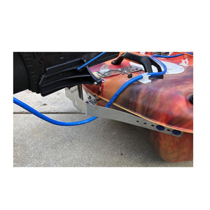 Bixpy WillFit Gudgeon attached to a red/orange kayak. Adapter and blue connection cord are also visible.