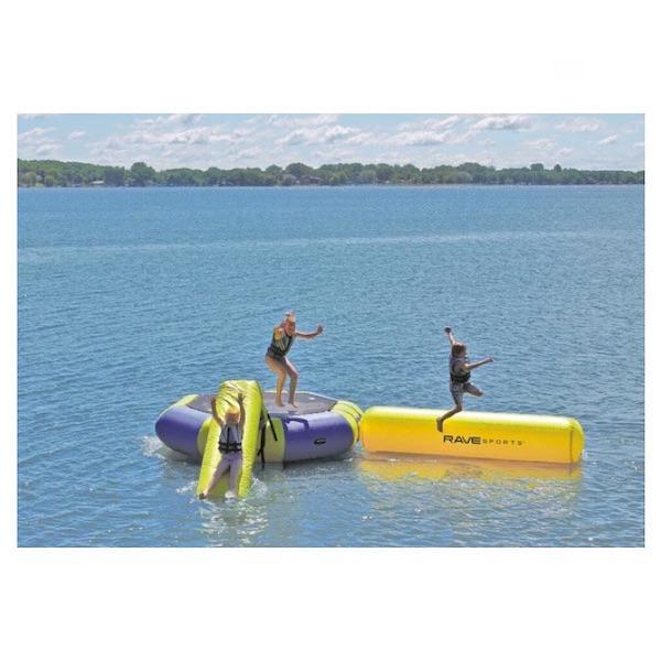 3 kids play on the Rave Bongo 10 Water Park with Small Aqua Log and Small Slide.  The Bongo Water Bouncer sits in the middle of a lake on a beautiful day.