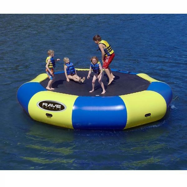 Yellow and blue Rave Bongo 15 Water Bouncer on the lake with 5 young kids playing on the black bounce surface.