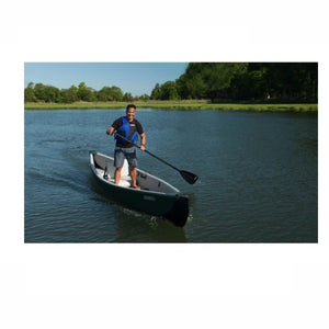 Man standing and paddling in a Sea Eagle Inflatable Canoe 16