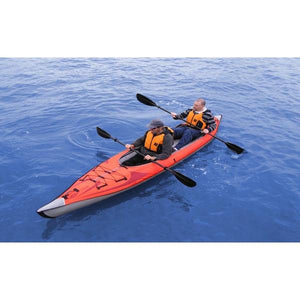 Top view of the Red Advanced Elements AdvancedFrame Convertible Inflatable Kayak with 2 paddlers out on the water.