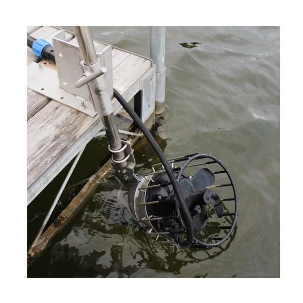 A Kasco De Icer Dock Mount is in use and shown attached to a dock on a lake, closeup view of the de icer dock mount.