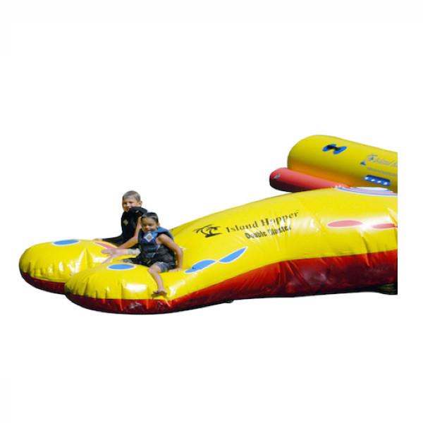 1 kids sitting on the Island Hopper Double Blaster Water Trampoline Attachment.  Image on a white background.