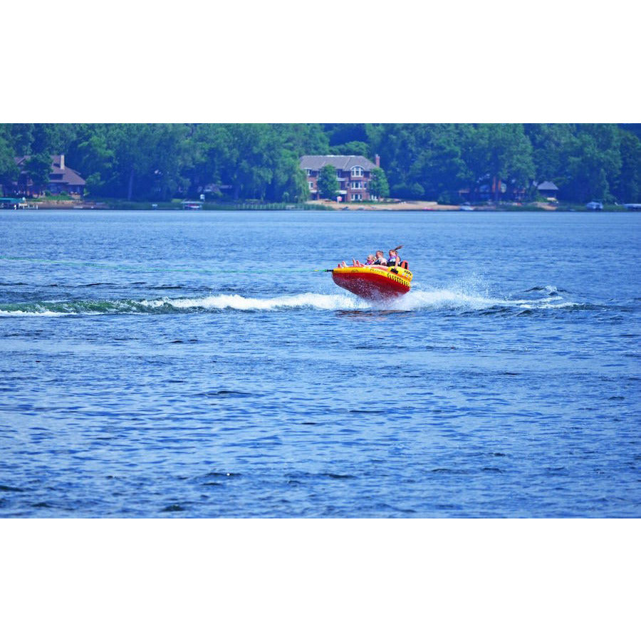 RAVE #Epic 3 Person Towable Boat Tube flying over a wave out on the lake. 