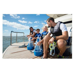 A family on the back of a boat about to usse their Yamaha Explorer Seascooters out on the ocean.