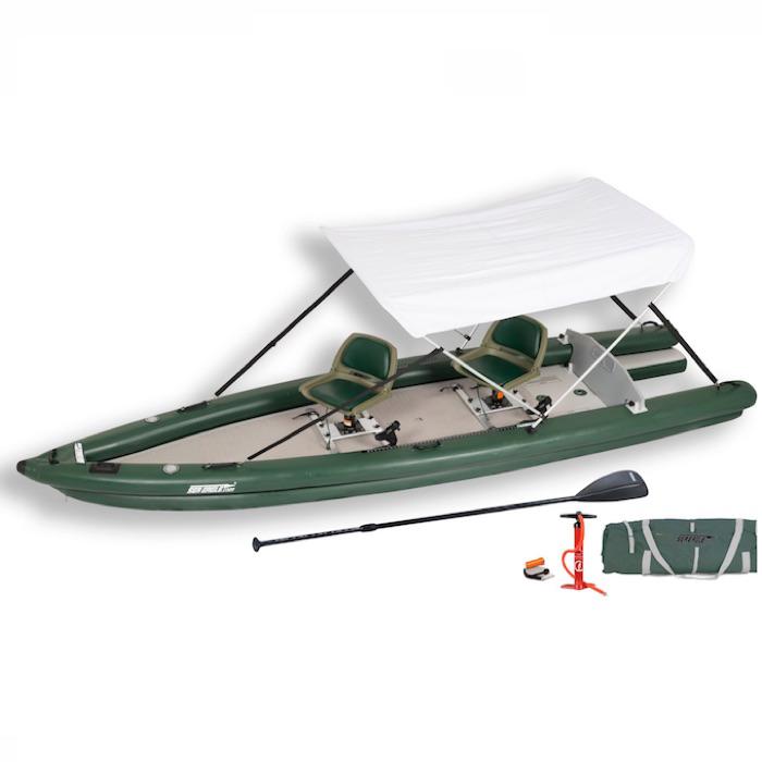 Sea Eagle FishSkiff 16 Inflatable Fishing Skiff with canopy top and side display view with the bag and pump sitting next to the Sea Eagle inflatable kayak. 