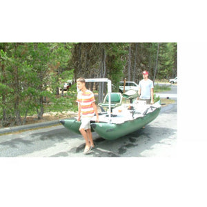 2 people carrying the Sea Eagle 375 FoldCat Inflatable Pontoon Fishing Boat from the front and back. 