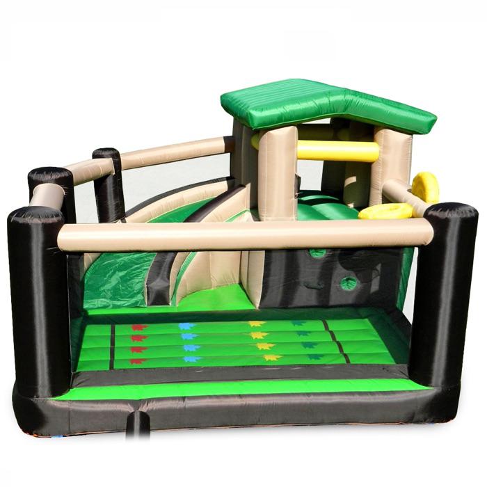 Island Hopper Fort All Sport Jump House front view of the inflatable bounce house.  Green interior flooring and slide with black borders and inflatable poles.  Green roof on the lookout tower and tan trim. 