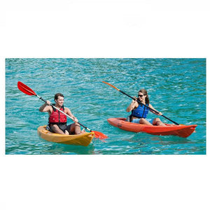 Point 65 Tequila GTX Orange and Yellow Modular Sit On Top Kayak Solo in action with each person paddling out in the sea.