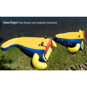 Island Hopper 15' Gator Monster Water Trampoline Water Park attachments sitting next to the lake.