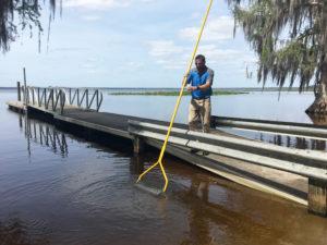 Jenlis Muck Razer being used to clean out a lake