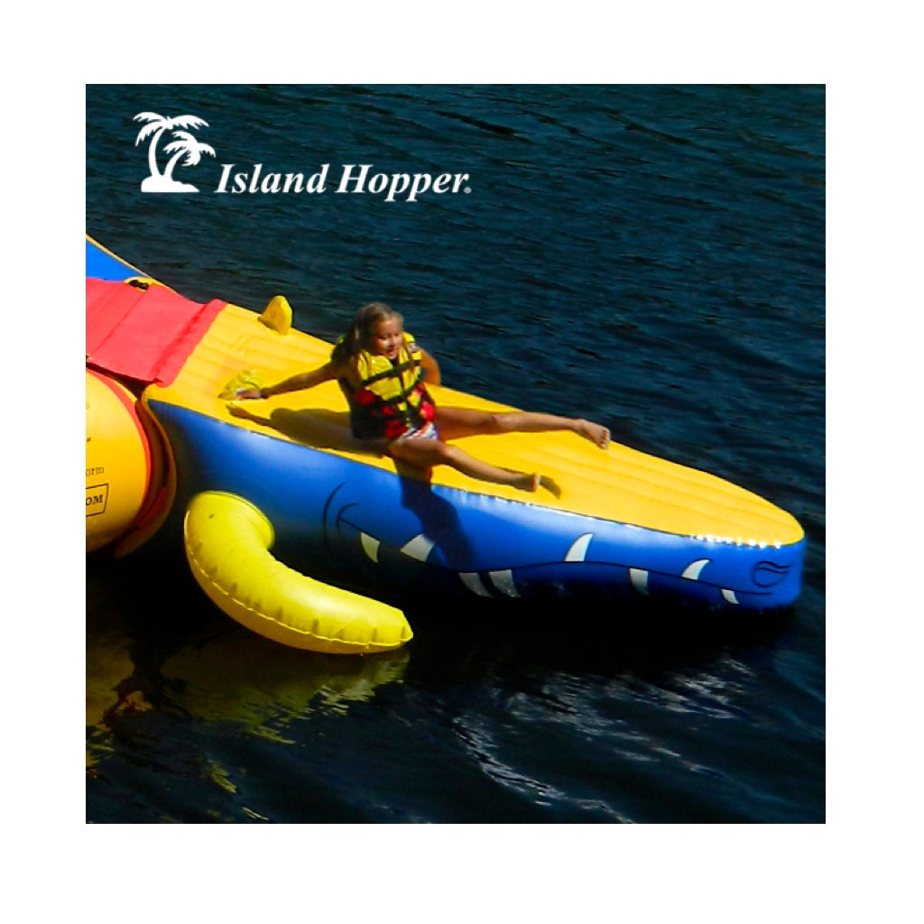 The Island Hopper Gator Monster Head Water Trampoline and Water Bounce Attachment. Yellow on top of the slide, blue on the side with gator teeth.