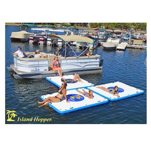 3 Island Hopper Island Buddy Floating Swim Platforms are hooked together in a T shape coming off of a pontoon boat.  The Island Hopper floating swim platforms are white with a blue logo with yellow lettering that reads Island Hopper Island Buddy Floating Swim Platform.  The border of the square floating swim platform is light blue.