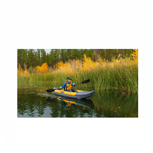Yellow and grey Advanced Elements Island Voyage 2 Tandem Inflatable Kayak out on the water.
