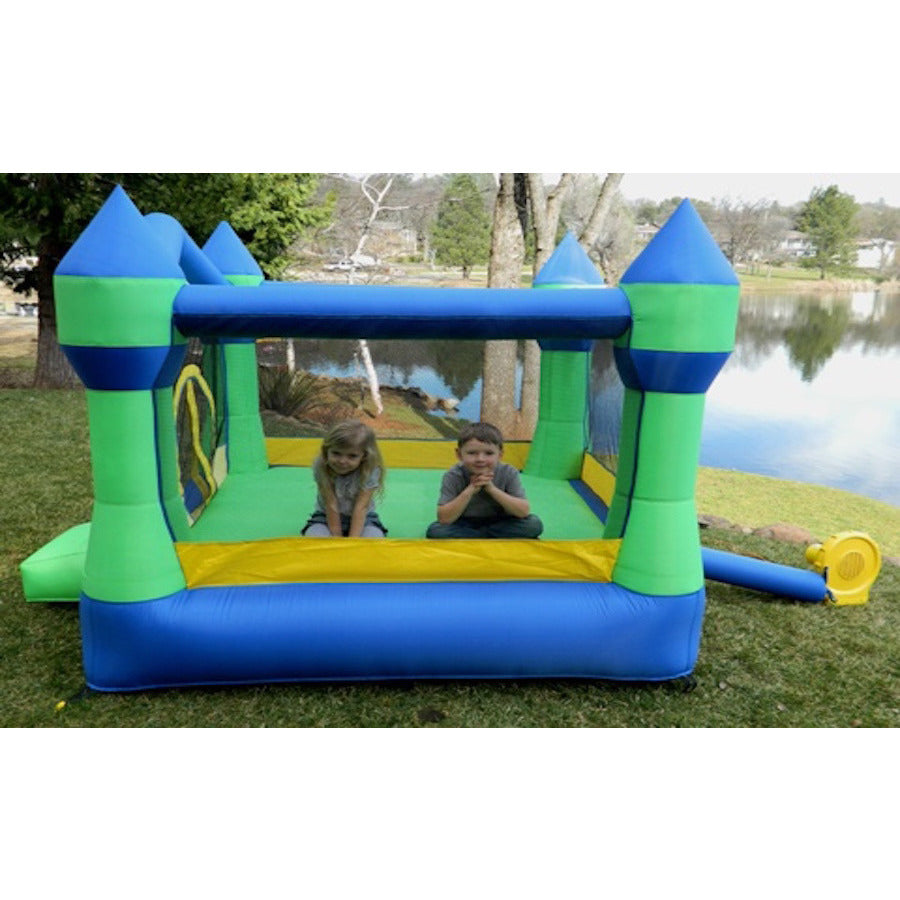 2 kids playing in the Island Hopper Jump Party Bounce House out in the backyard.  
