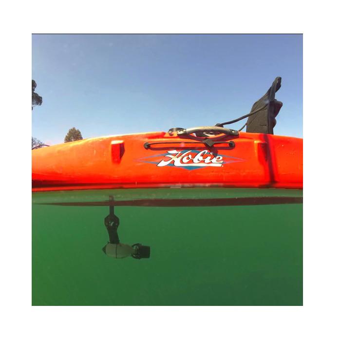 Underwater side view of a Bixpy Kayak Jet Motor Outboard Kit in use with an orange Hobie Kayak, using a Bixpy Hobie Mirage Pedal Adapter.  The Bixpy Jet Thruster is visible through the water below the kayak.
