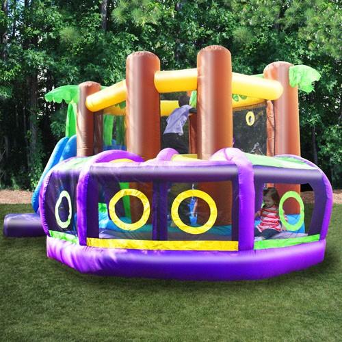 KidWise Monkey Explorer Jumper view of the wrap around tunnel on the back of the bounce house.  The purple supports and yellow circle windows in the double mesh netting are showcased.