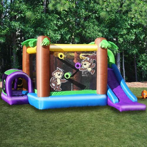 Side view of the KidWise Monkey Explorer Jumper in the backyard. You can see the front of the slide and the entry into the wrap around crawl tunnel.  