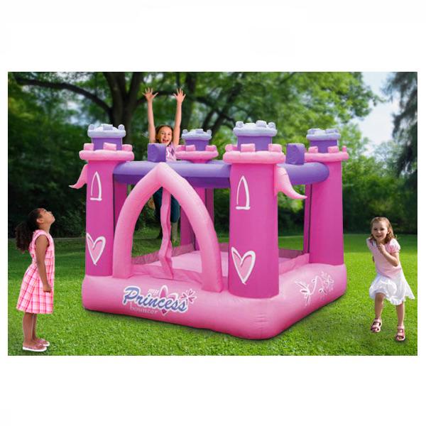 KidWise My Little Princess Bounce House.  Pink inflated floor with pink inflated castle tower supports in each corner of the square bounce house.  Inflated purple cross supports connect the castle towers.  Pink arch shaped entry is visible in front.  The view is from the front of the recreational bouncer.