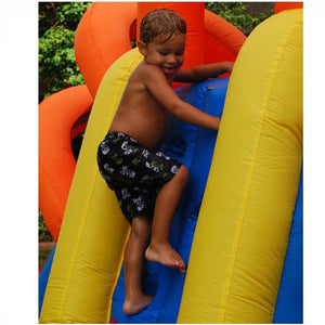 KidWise Summer Blast Waterpark, young boy climbing the climbing wall up to the slide