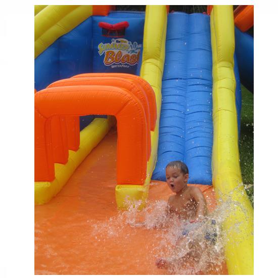 Kid sliding in to the splashy zone of the KidWise Summer Blast Waterpark