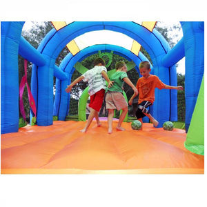 KidWise Arc Arena II Inflatable Sports Bounce House inside view showcasing kids playing soccer on the orange bouncer floor.