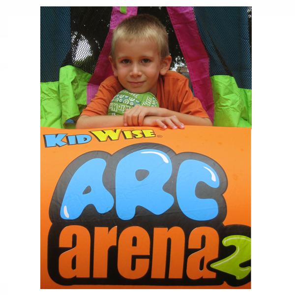KidWise Arc Arena 2 Sports Bounce House with a kid laying out the entry area with a soccer ball under his chin.
