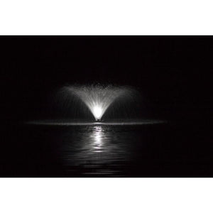 Power House F1000F 115v-230v 1 Hp Aerating Fountain with a white Light Kit lighting up the v shaped spray on a pitch black night.