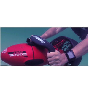 Underwater view of the Yamaha RDS200 Sea Scooter.  The view of the seascooter is from the left hand side and you can clearly see the white and black lettering that says Yamaha RDS200 Sea Scooter.  A riders hands are seen in place on the handle.