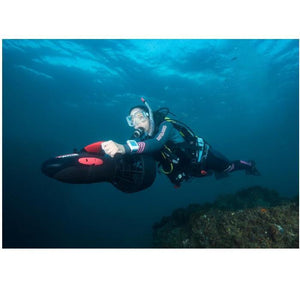 Yamaha RDS300 Sea Scooter exploring underwater with a woman riding.  All black with red design.