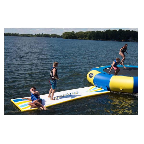 Kids playing on a Rave Water Whoosh Floating Water Mat attached to a Rave Water Trampoline on the lake.