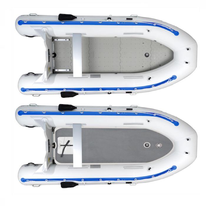 Sea Eagle 14' Sport Runabout Inflatable Boat top view with the bag and pump sitting next to the white Sea Eagle inflatable boat with blue lettering.