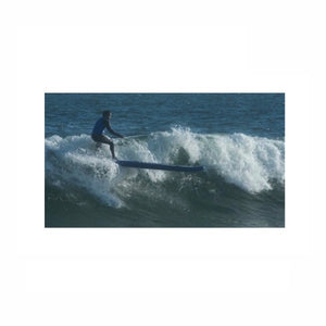 Sea Eagle Longboard 126 Inflatable SUP riding a wave.