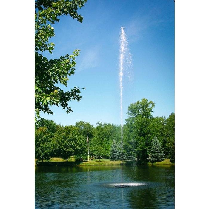 Scott Aerator Jet Stream Pond Fountain 1 1/2 Hp Floating Fountain shows off its astonishing 50 feet columnar spray.  The Jet Stream Floating Fountains are some are the most popular floating fountains on the market.  Shown here as a pond water fountain in a park setting.  Trees around a lake with open green grassy areas also.