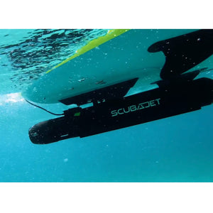 Close up of the ScubaJet Pro Overwater Kit. It is attached to a SUP and being used as a paddleboard motor. The ScubaJet Pro is all black with silver scubajet logo.