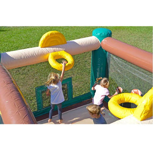 Island Hopper Sports N Hops Commercial Jump House features 2 basketball goals. Here you see a young girl dunking on the basketball goal of this best commercial bounce house for sale.