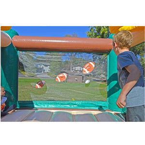 Island Hopper Sports N Hops Commercial Jump House Football Throw Game. There are 2 young kids throwing the ball at 3 different footballs on the transparent bounce house wall.
