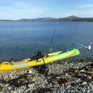 Universal Kayak and Canoe Adapter attached to a yellow-green kayak near the lake