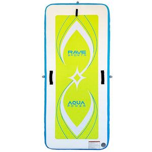 This image is displaying the Rave Aqua Power Fitness Mat face up and in an upright position. It has a light-hue of blue on each side of the rectangular-shape. On top is the design with combined colors of neon yellow, white and some sky blue colors with the brand imprinted on the mat.