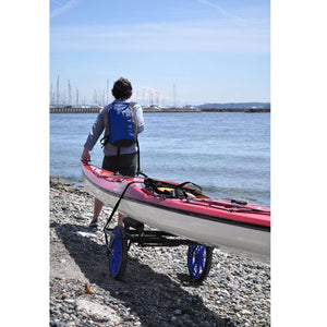 This is a picture of a kayak on the Seattle Sports Paddleboy ATC All-Terrain Center Cart at the beach.
