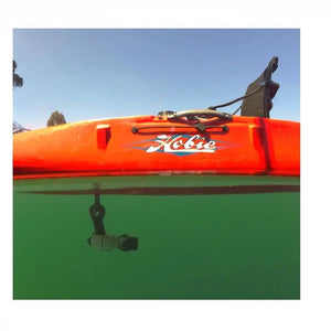 Underwater view of the Bixpy Hobie Mirage Pedal Adapter.  Shown attached to an orange Hobie Kayak and in place underneath the seat of the kayak.