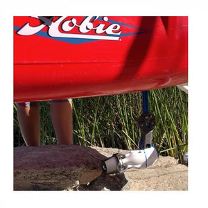 Bixpy Hobie Mirage Pedal Adapter in place underneath the kayak outside of the water.  White Bixpy Jet Motor is clearly visible after being attached to the the Hobie Mirage Pedal Adapter.