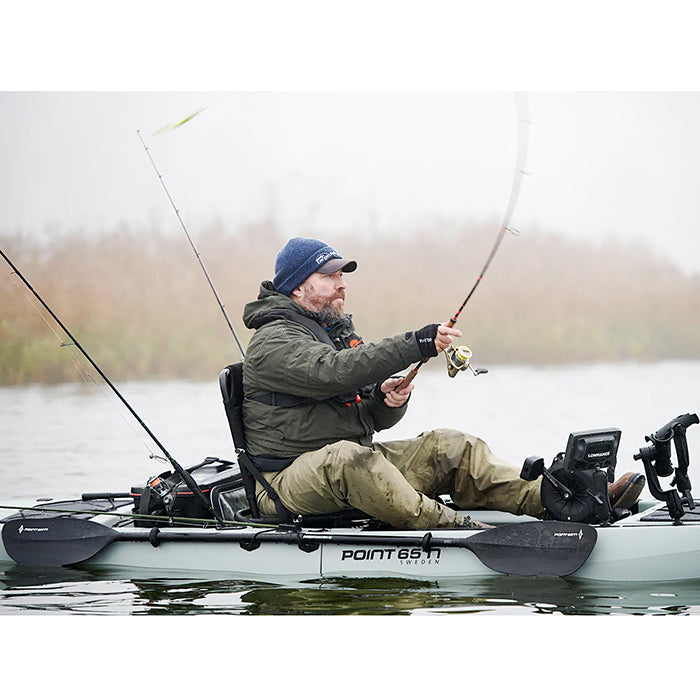 This is the Grey KingFisher Solo Modular Fishing Kayak in action out in the lake with a person fishing on it.