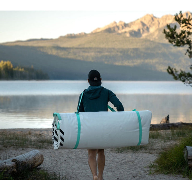 POPUP Inflatable Dock folded and carried on a man&#39;s back.