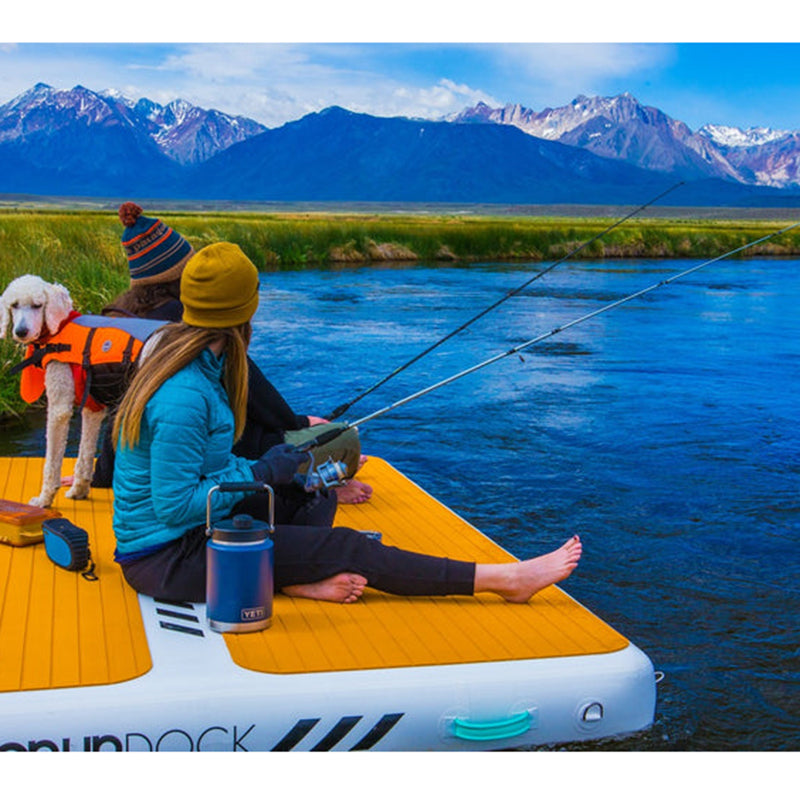 POPUP Inflatable Dock on the pond with a dog and two adults fishing on it.
