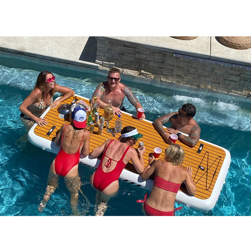 POPUP Plank Inflatable Dock on the pool with 6 adults surrounding it and their drinks/liquors on top of the plank.