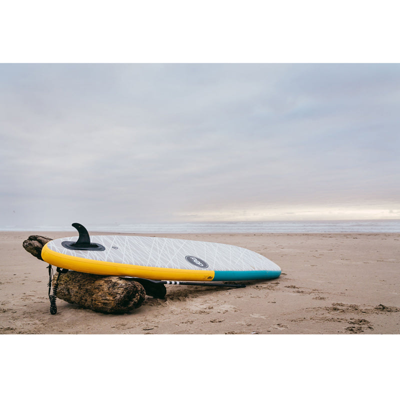 Paddleboards 11&#39;0 Pop Up Inflatable SUP resting on the beach