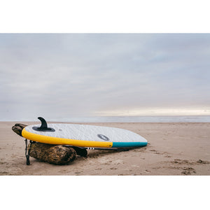 Paddleboards 11'0 Pop Up Inflatable SUP resting on the beach